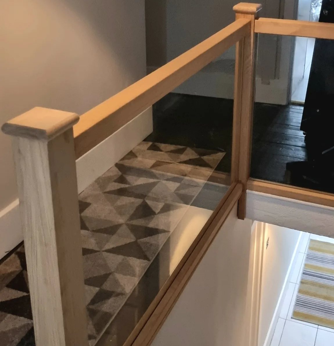 Oak and glass landing balustrade with square newel posts